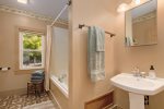 Full bathroom with jetted soaking tub and shower combo